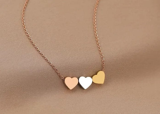  View details for Triple Heart Necklace in Rose Gold Silver and Gold Triple Heart Necklace in Rose Gold Silver and Gold