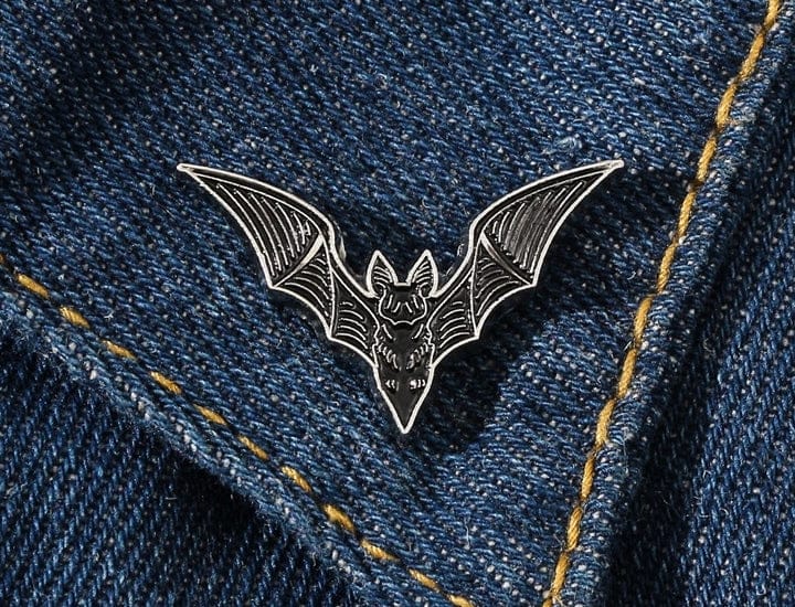 small black bat pin on jacket